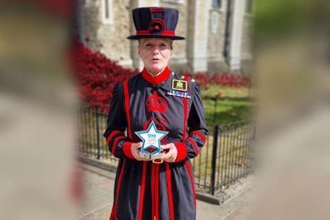 Yeoman Warder with the trophy for Best Historic Attraction or Venue